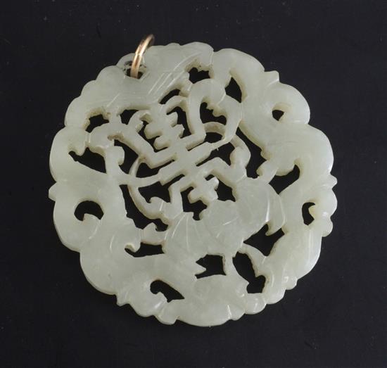 A Chinese pale celadon and jade circular plaque, 19th century, diameter 5.4cm